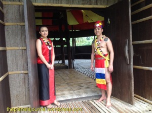 Greeted by a Bidayuh warrior and maiden
